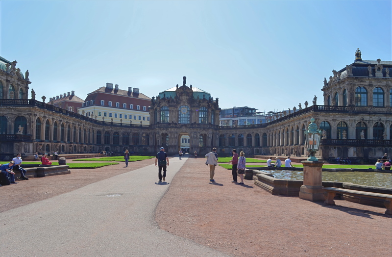 25 - The expansive inner courtyard of the historic Zwinger Palace in Dresden, Germany, highlighting its ornate Baroque architecture, symmetrical gardens, and the Glockenspiel Pavilion